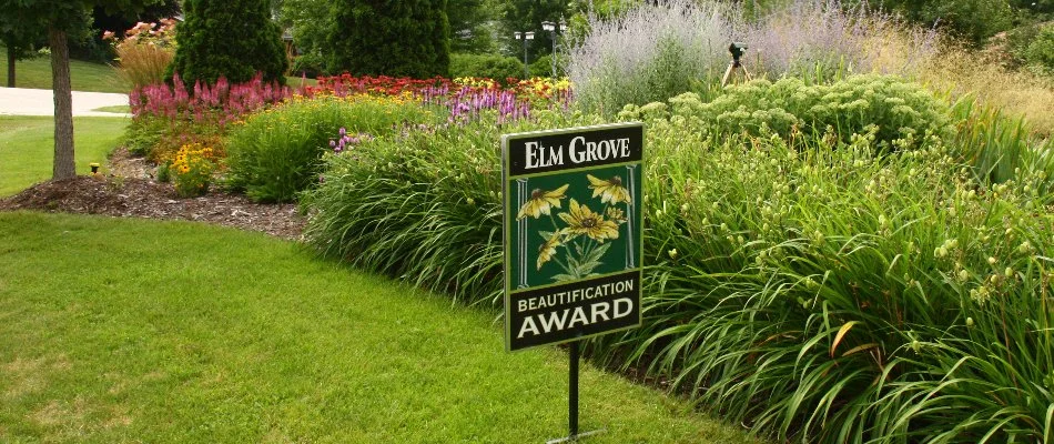 Pretty plants behind an award sign in Elm Grove, WI.