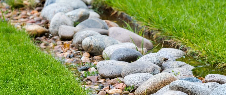 Water flowing through a dry creek bed in Elm Grove, WI.