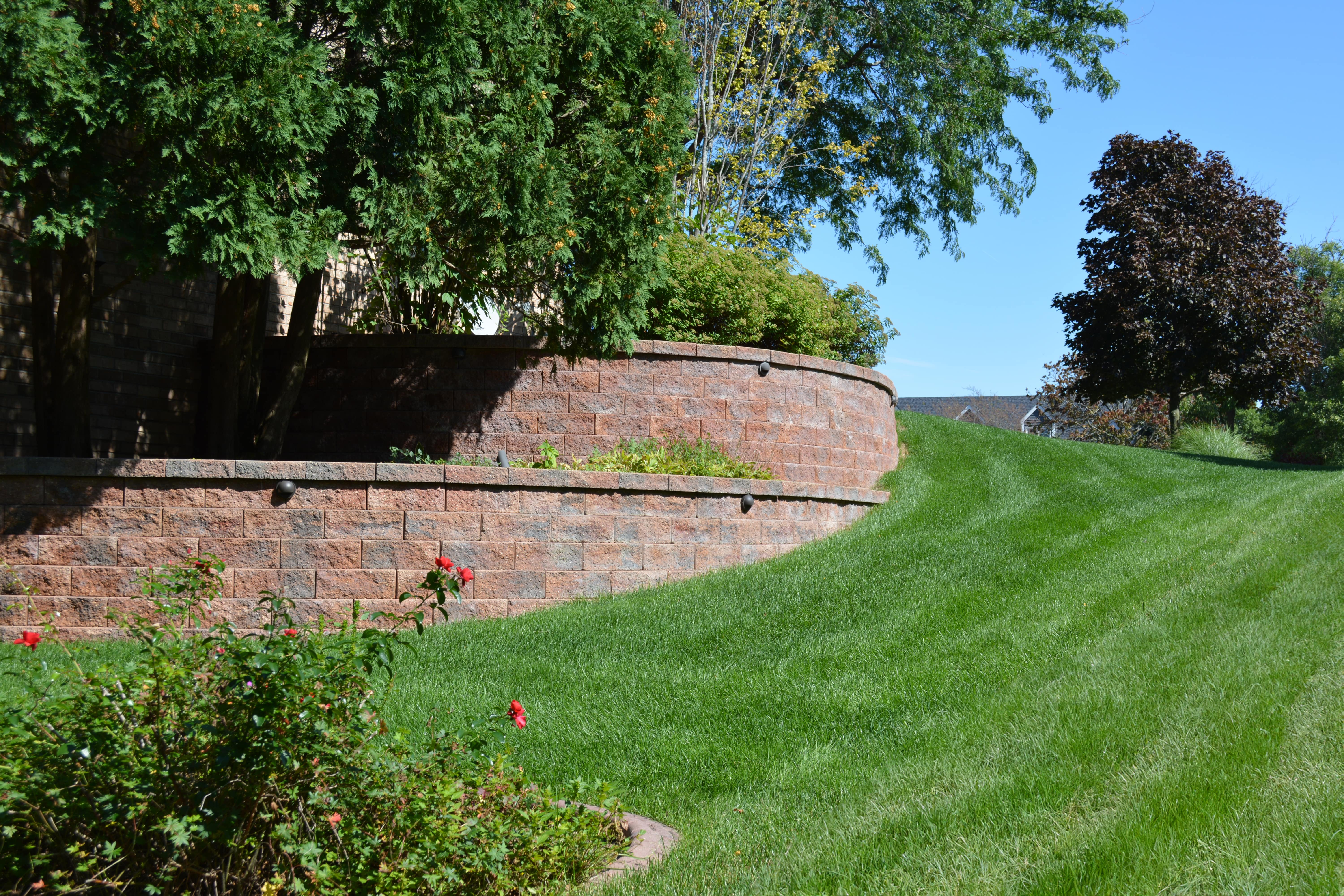 Terraced lawn with stone retaining wall